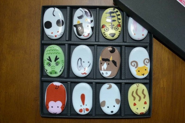 A set of chopstick rests with the Zodiac signs in a box made of Arita ware