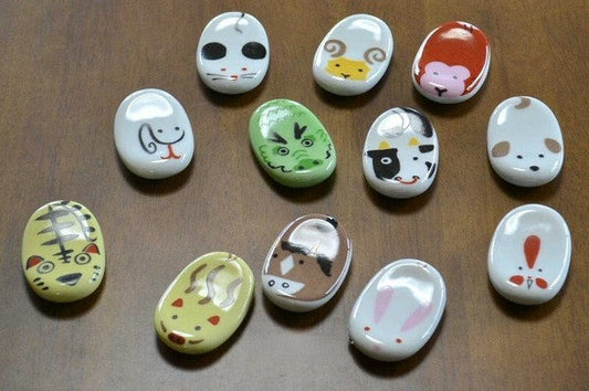 A set of chopstick rests with the Zodiac signs in a box made of Arita ware